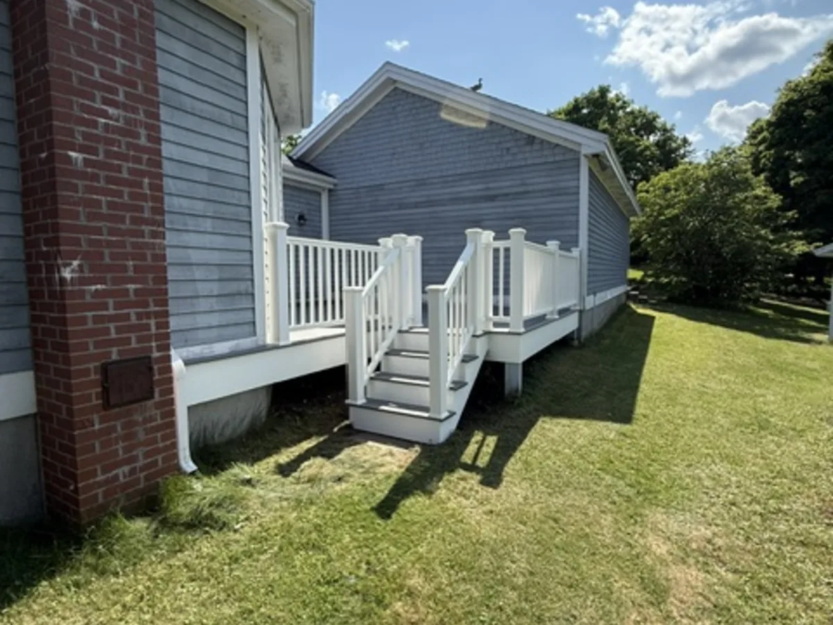 Coastal composite deck renovation with TimberTech decking by Oceanside Carpentry